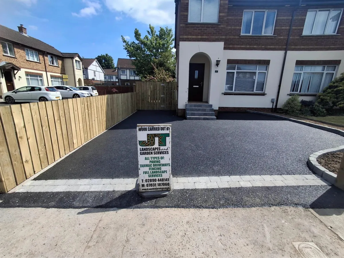 Completed driveway with JT Landscapes sign