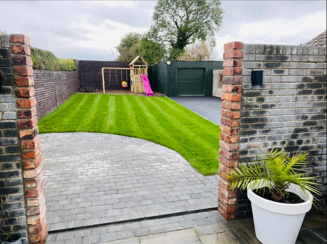 Patio with lawn and retaining wall